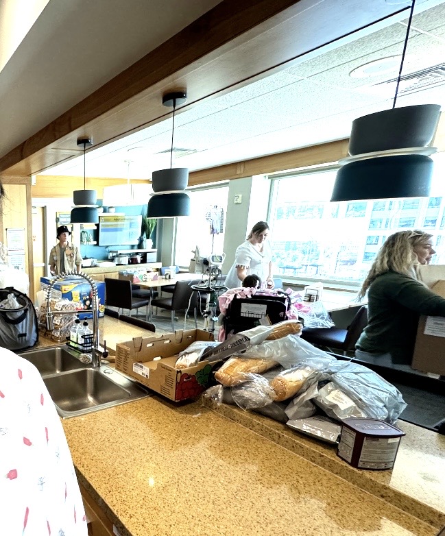 Volunteers preparing food in a Ronald McDonald House kitchen space
