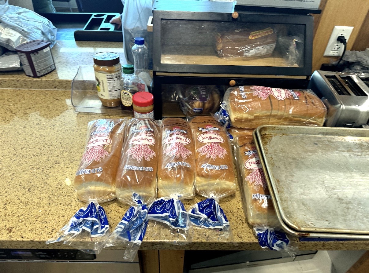 Bread and meal supplies prepared on a kitchen counter